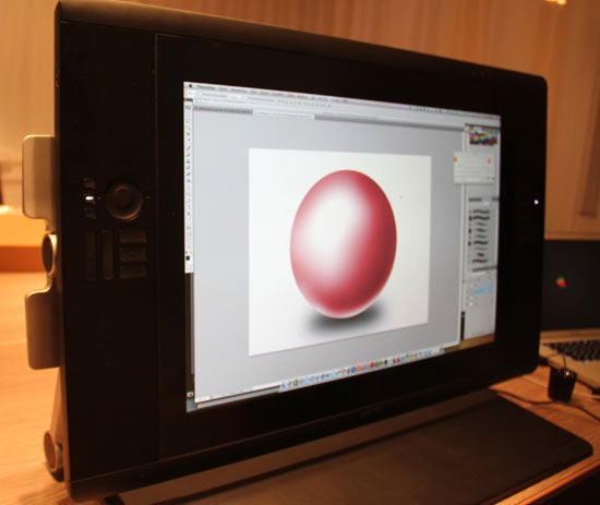 Wacom Cintiq 24HD 6Wacom Cintiq 24HD graphic display with a digital red sphere illustration.